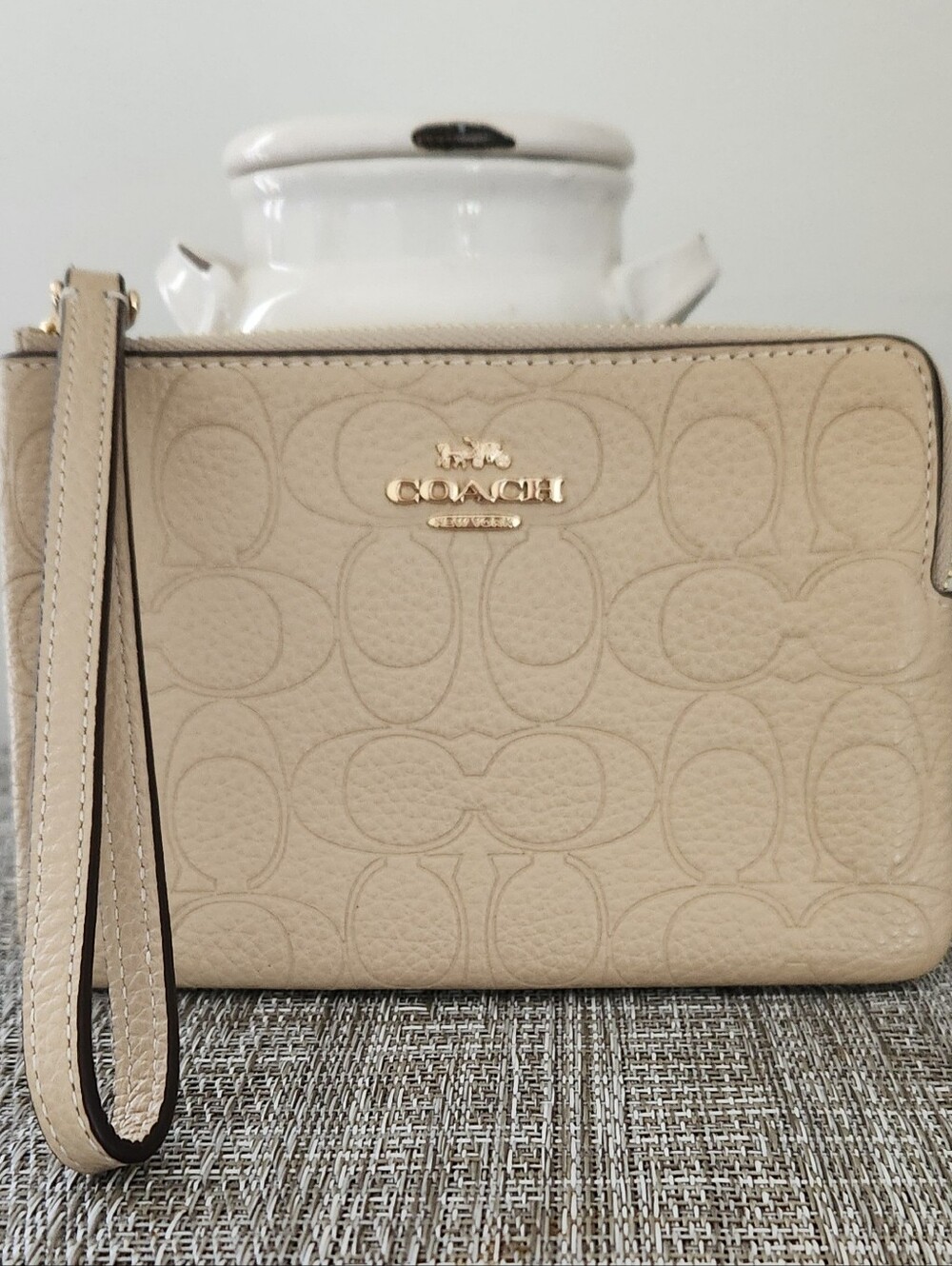 Coach Pebbled Signature Zip Wristlet in Light Beige
